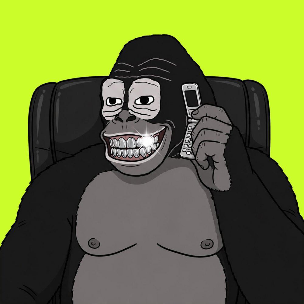 Gorilla in an office chair on a silver flip phone